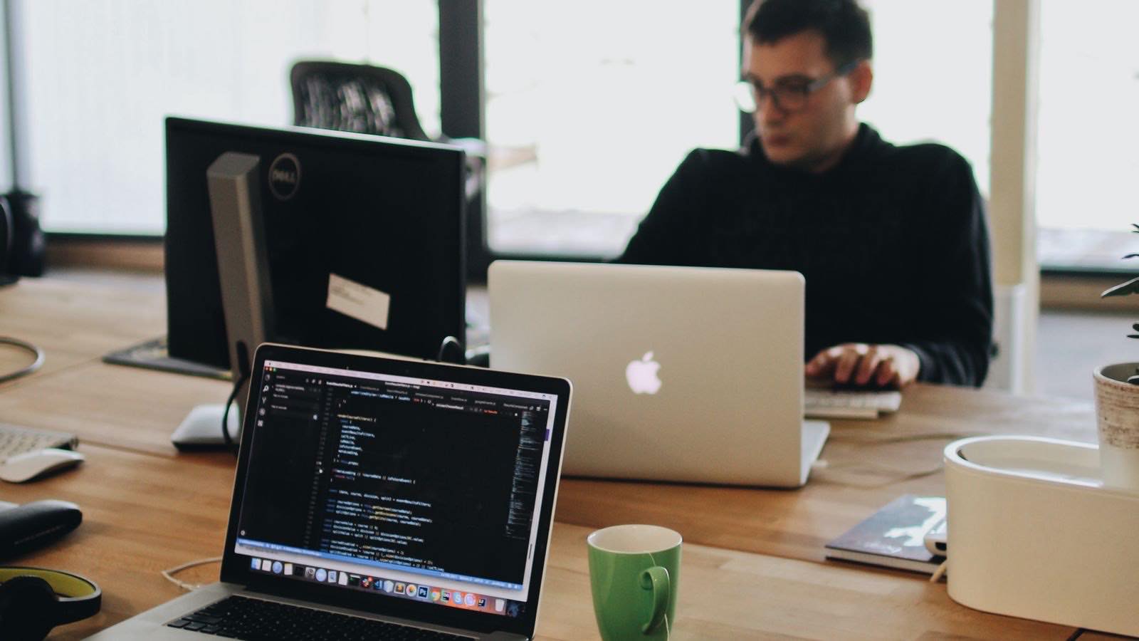 Web developer writing an llms.txt file in a code editor